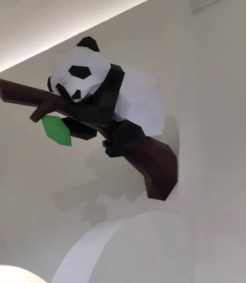 3D DIY paper cut panda perched on a tree